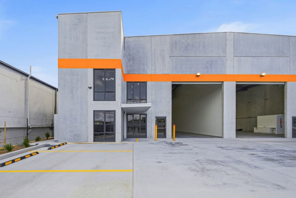 Completed AJA industrial building with concrete panel walls, roller doors and hardstand at Gateway Boulevard, Morisset Completed AJA industrial building with concrete panel walls, roller doors and hardstand at Gateway Boulevard, Morisset